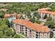 Stunning aerial shot of condos nestled among trees, showcasing the community's lush surroundings at 1375 Tuscana Ln # 1405, Davenport, FL 33896