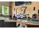 Full service bar with TVs and bar top seating at 1375 Tuscana Ln # 1405, Davenport, FL 33896