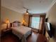 A serene bedroom bathed in soft light features a ceiling fan, soft bedding, and a tranquil ambiance at 1375 Tuscana Ln # 1405, Davenport, FL 33896