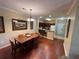 A warmly lit dining area seamlessly flows into the kitchen, creating an inviting space for gatherings at 1375 Tuscana Ln # 1405, Davenport, FL 33896