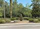 Picturesque tiered water fountain at the community entrance, surrounded by lush landscaping at 1375 Tuscana Ln # 1405, Davenport, FL 33896