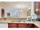 Kitchen with granite countertops, stainless steel sink, and modern appliances in the Toscana condo at 1375 Tuscana Ln # 1405, Davenport, FL 33896