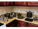 A kitchen with well-organized collection of cookware and granite counter tops at 1375 Tuscana Ln # 1405, Davenport, FL 33896