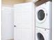 Convenient laundry area with stackable washer and dryer units at 1375 Tuscana Ln # 1405, Davenport, FL 33896