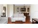 Open-concept living room with hardwood floors and comfortable seating and a dining area in the back at 1375 Tuscana Ln # 1405, Davenport, FL 33896