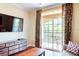 Cozy living room with balcony access offering scenic views and natural light with stylish decor at 1375 Tuscana Ln # 1405, Davenport, FL 33896