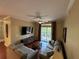 A comfortable living room with neutral tones and a sliding glass door that brings in natural light at 1375 Tuscana Ln # 1405, Davenport, FL 33896