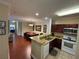 An inviting space featuring an open floorplan and a seamless transition from the kitchen to the dining area at 1375 Tuscana Ln # 1405, Davenport, FL 33896