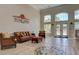 Spacious lobby with cozy seating, tile floors, and abundant natural light at 1375 Tuscana Ln # 1405, Davenport, FL 33896