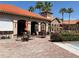 Outdoor patio area offering tables, chairs, and sun umbrellas at 1375 Tuscana Ln # 1405, Davenport, FL 33896