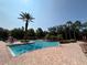 Outdoor pool, featuring several lounge chairs and tropical landscaping at 1375 Tuscana Ln # 1405, Davenport, FL 33896