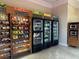 Convenient snack area with refrigerators and shelves stocked with various food and drink options at 1375 Tuscana Ln # 1405, Davenport, FL 33896
