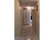 Hallway showcases neutral walls and tiled flooring, enhanced by a large storage cabinet, and creating flow at 13838 Fairway Island Dr # 1418, Orlando, FL 32837
