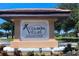 Audubon Villas at Hunter's Creek sign surrounded by well-maintained landscaping at 13838 Fairway Island Dr # 1418, Orlando, FL 32837