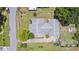 Aerial view showcasing a home's roof, layout, driveway and surrounding landscaping at 1640 Marks St, Kissimmee, FL 34746