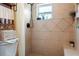Tiled shower room with a large shower and a built-in bench, designed for relaxation and convenience at 1640 Marks St, Kissimmee, FL 34746