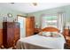 Cozy bedroom with wooden furniture and natural light at 1640 Marks St, Kissimmee, FL 34746