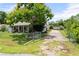 Inviting single-story home with a well-manicured lawn and fenced yard at 1640 Marks St, Kissimmee, FL 34746