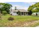 Charming single-story home featuring a well-manicured lawn and mature landscaping at 1640 Marks St, Kissimmee, FL 34746