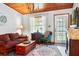 Comfortable living room showcasing a wood ceiling, fireplace, and cozy seating at 1640 Marks St, Kissimmee, FL 34746