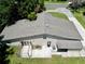 Aerial view of the back of a home featuring a patio, pergola, and well-manicured landscaping at 1843 Harbor Blvd, Kissimmee, FL 34744