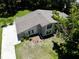 Aerial view of the home displaying the roof and the surrounding landscaped yard at 1843 Harbor Blvd, Kissimmee, FL 34744