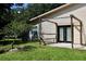 A wooden pergola and rear patio in the backyard at 1843 Harbor Blvd, Kissimmee, FL 34744