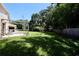 Large backyard with unfinished deck and partially covered patio at 1843 Harbor Blvd, Kissimmee, FL 34744