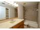 Bathroom featuring a large mirror and a tub and shower combo at 1843 Harbor Blvd, Kissimmee, FL 34744