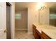 Bathroom featuring double sinks, white tile floors, and ample counterspace at 1843 Harbor Blvd, Kissimmee, FL 34744
