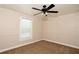 Bedroom featuring a ceiling fan, one window for natural light, neutral paint and carpeting at 1843 Harbor Blvd, Kissimmee, FL 34744