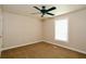 Bedroom featuring a ceiling fan, one window for natural light, neutral paint and carpeting at 1843 Harbor Blvd, Kissimmee, FL 34744