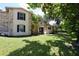 Charming two-story home with stone accents, dark shutters, and a lush lawn at 1843 Harbor Blvd, Kissimmee, FL 34744
