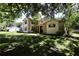 Lovely two-story home with stone accents and mature trees for a picturesque setting at 1843 Harbor Blvd, Kissimmee, FL 34744