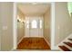 Bright foyer featuring hardwood floors, decorative lighting, and a glass-paneled front door at 1843 Harbor Blvd, Kissimmee, FL 34744