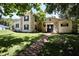 Charming two-story home with stone accents, black shutters, and a brick walkway at 1843 Harbor Blvd, Kissimmee, FL 34744