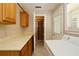 Laundry room features a washer, utility sink, and storage cabinets, providing functionality and organization at 1843 Harbor Blvd, Kissimmee, FL 34744