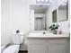Bright bathroom featuring a single sink vanity, large mirror, and decorative accents at 1851 Hammock Moss Dr, Orlando, FL 32820