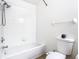 Full bathroom featuring white tiled shower-tub and a white toilet at 1851 Hammock Moss Dr, Orlando, FL 32820