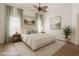 Bright and airy bedroom featuring neutral decor, a ceiling fan and hardwood floors at 1851 Hammock Moss Dr, Orlando, FL 32820