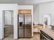 Kitchen featuring stainless steel refrigerator and tile floors at 1851 Hammock Moss Dr, Orlando, FL 32820