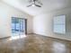 Light filled living room with tiled floors and access to the pool at 1851 Hammock Moss Dr, Orlando, FL 32820