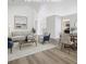 Bright, staged living room featuring hardwood floors and neutral-colored furniture at 1851 Hammock Moss Dr, Orlando, FL 32820