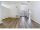 Open-concept living room with lots of natural light and hardwood floors at 1851 Hammock Moss Dr, Orlando, FL 32820