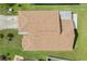 Birds eye view of the roof with new shingles and a well-maintained lawn at 1914 Ellery Ln, Kissimmee, FL 34746