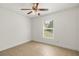 Bedroom featuring a window, ceiling fan, and tile flooring at 1914 Ellery Ln, Kissimmee, FL 34746