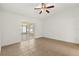Bedroom featuring sliding doors to the sunroom and tile flooring at 1914 Ellery Ln, Kissimmee, FL 34746