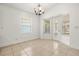 Bright dining room with a chandelier and access to the outdoors at 1914 Ellery Ln, Kissimmee, FL 34746
