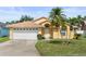 Charming single-story home featuring a two-car garage and well-maintained landscaping at 1914 Ellery Ln, Kissimmee, FL 34746