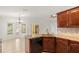 Kitchen featuring granite countertops, stainless steel appliances, and light tile flooring at 1914 Ellery Ln, Kissimmee, FL 34746